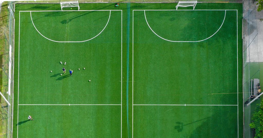 Two football pitches side by side